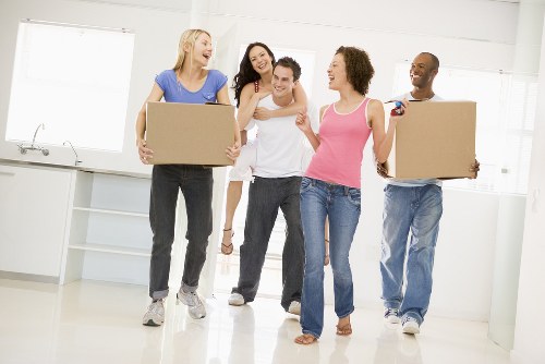 Professional flat removals team loading furniture for a Surrey apartment move