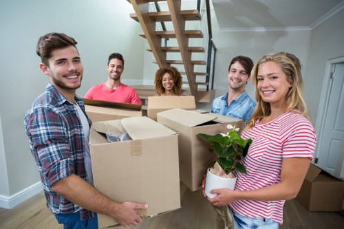 Moving team loading furniture into a removal van