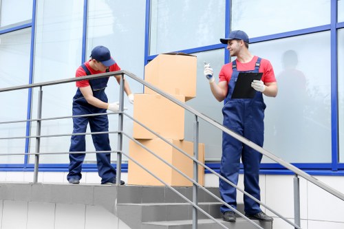 Furniture removals team handling large items for a Surrey home move