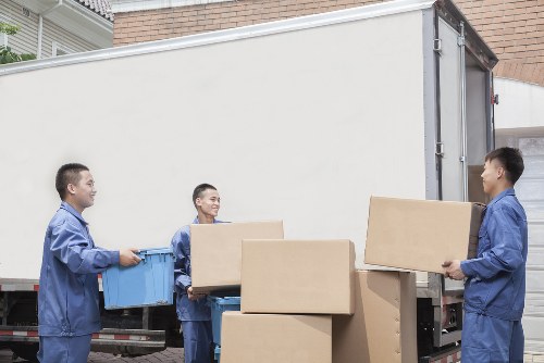 Packed office boxes and furniture ready for moving day