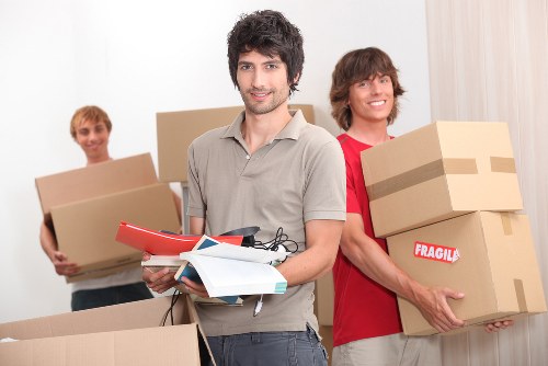 Moving boxes and household items ready for collection in Surrey