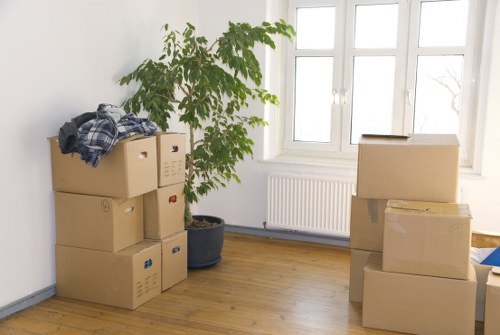 Professional movers loading furniture at a Surrey home