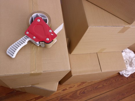 Professional movers loading household items for a Surrey relocation