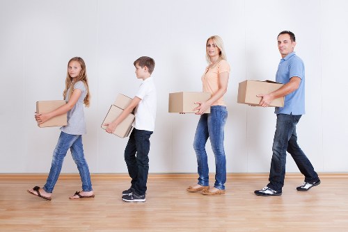 Careful loading of large furniture during a Surrey pick-up appointment