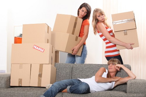 Professional movers loading furniture with care